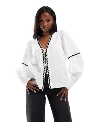 tie front balloon sleeve top with contast rick-rack trim in white