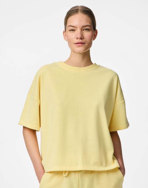 Pieces - Top a maniche corte color banana pallido