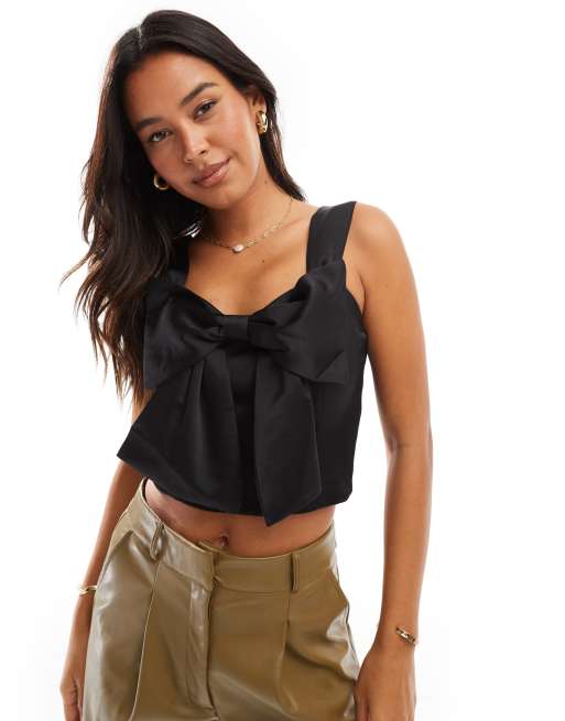 Pieces - Top nero con fiocco sul davanti