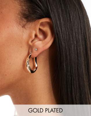 twisted hoop earrings in gold