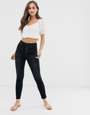 black jeans with buttons