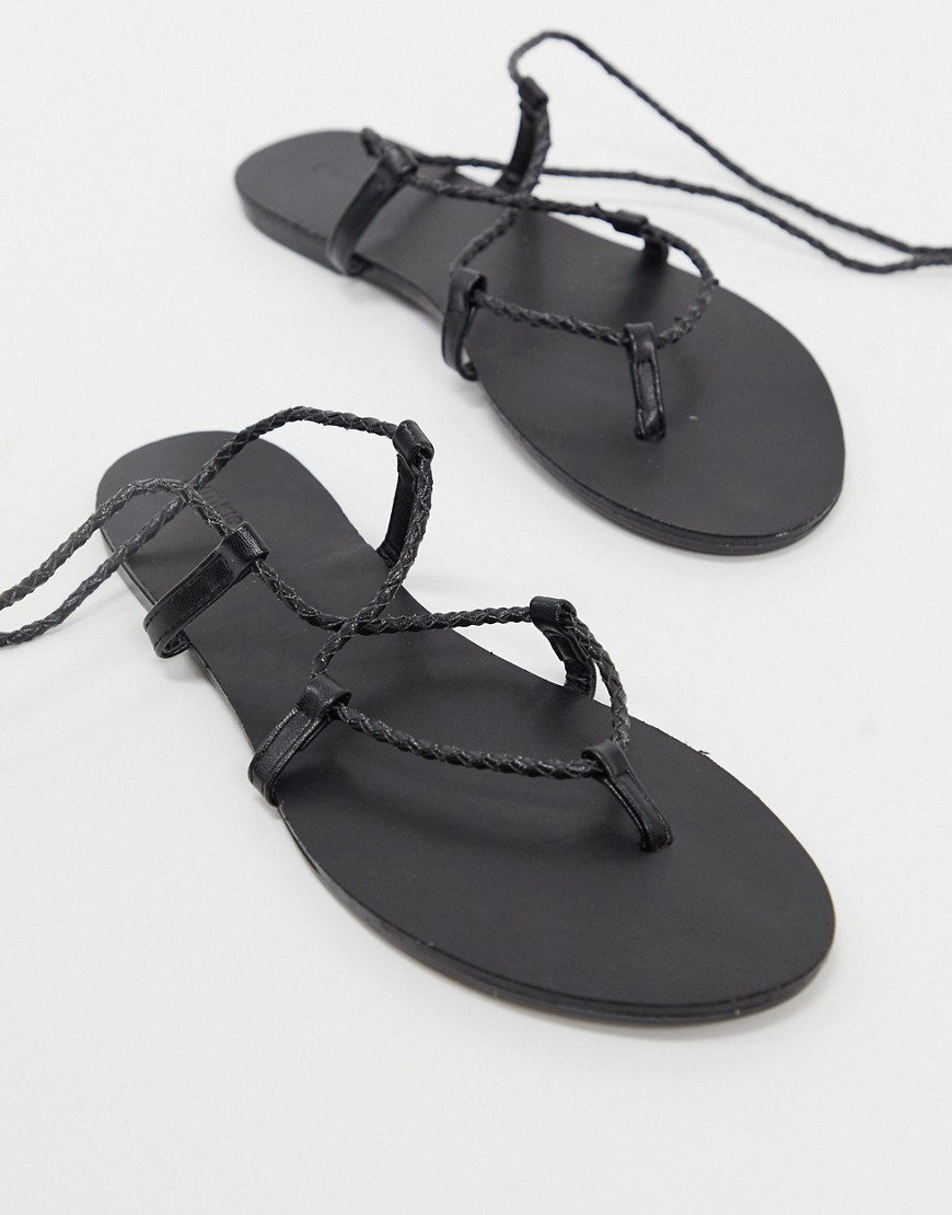 Pimkie - Platte sandalen met gevlochten wikkelband in zwart