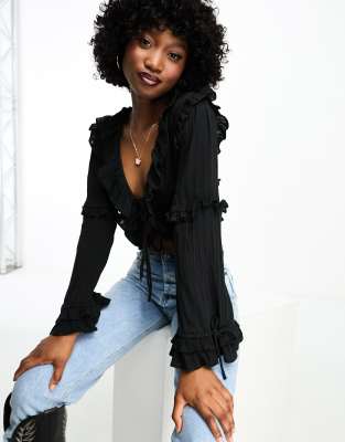 Pimkie ruffle tie front blouse in black | £33.00 | Grazia