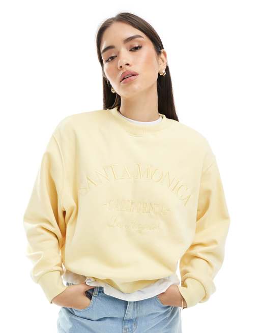 Pimkie 'Santa Monica' embroidered text sweatshirt in yellow