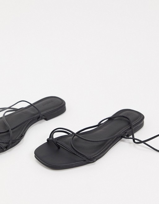 Pimkie wraparound flat sandals in black