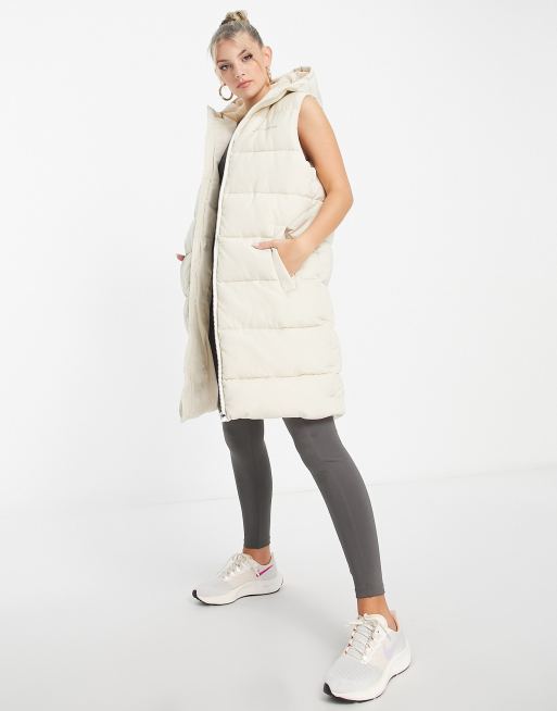 Pink Soda - Gewatteerde bodywarmer met lange pasvorm in zandkleur