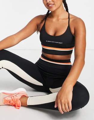 Pink Soda strappy cross back light support sports bra in black - ASOS Price Checker