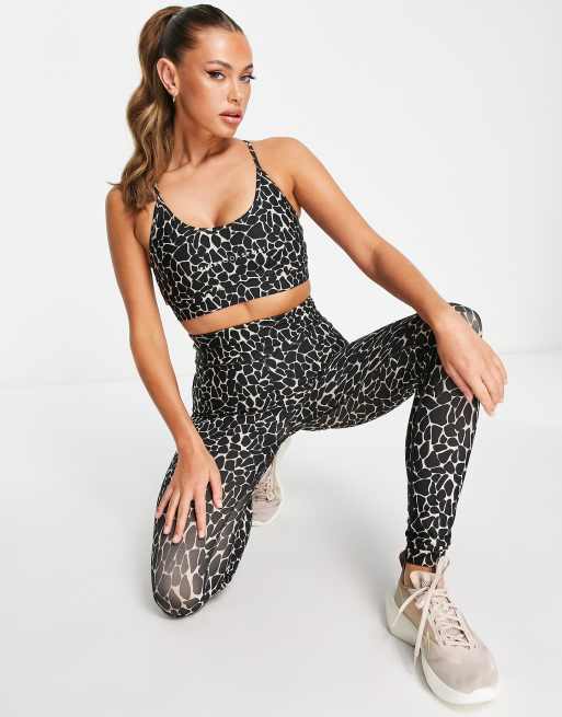 https://images.asos-media.com/products/pink-soda-strappy-light-support-sports-bra-in-black-animal-print/203017943-4?$n_640w$&wid=513&fit=constrain