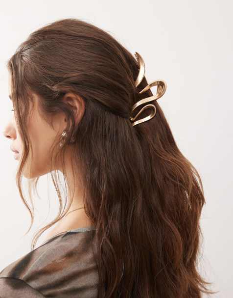 Pinza para el cabello dorada con diseño ondulado de Weekday - view 1