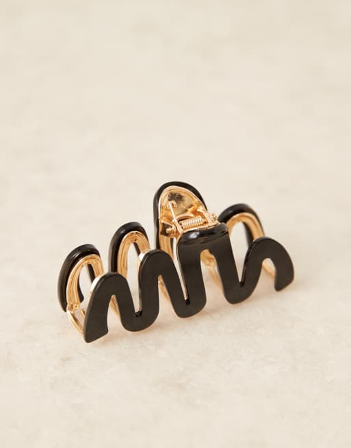 Pinza para el cabello negra y dorada con diseño ondulado de ASOS DESIGN, 2 de 3