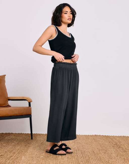 PixieGirl Petite acid wash cropped trousers in black, 2 of 4