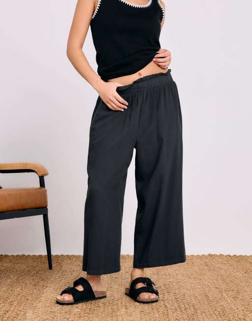 PixieGirl Petite acid wash cropped trousers in black, 4 of 4