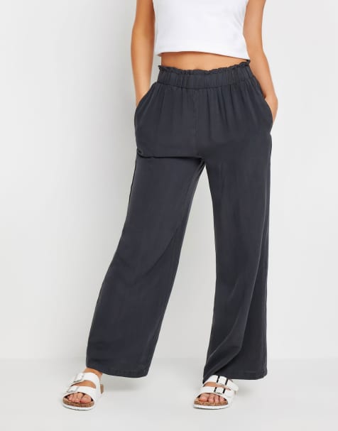 PixieGirl Petite acid wash wide leg trousers in black - view 1
