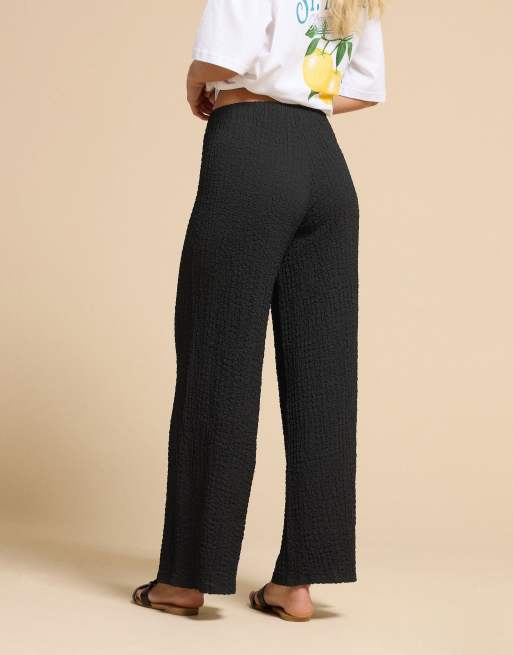PixieGirl Petite bubble textured wide leg trousers in black, 4 of 5
