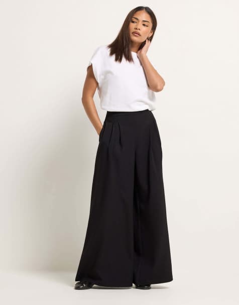 PixieGirl Petite pleated palazzo trousers in black