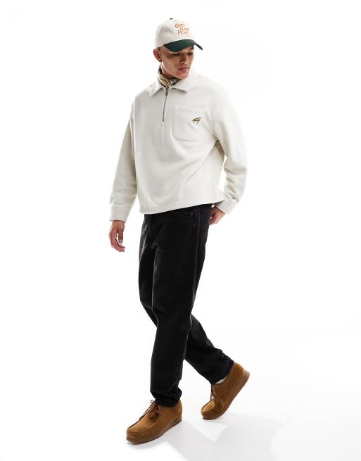 Polar beis holgado con media cremallera y logo de Tommy Jeans
