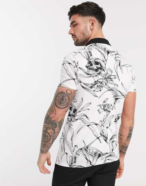 Polo ajustado con estampado de calaveras y cremallera en el cuello de DESIGN | ASOS