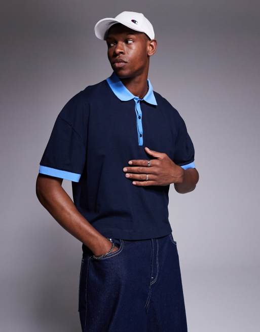Polo corto azul marino extragrande con hombros caídos de ASOS DESIGN