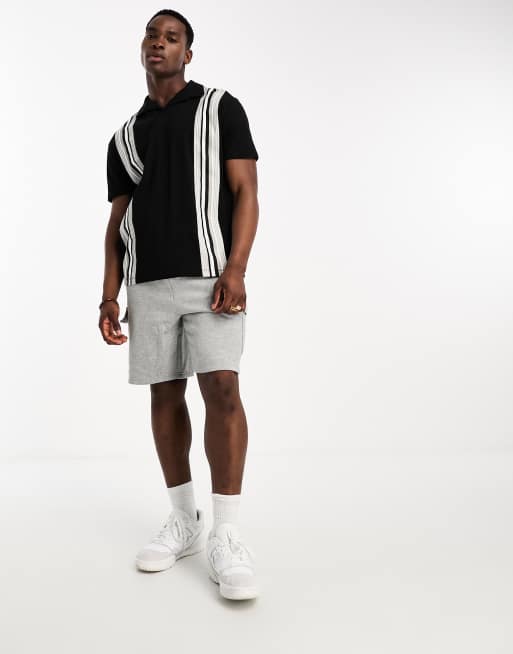 Polo negro a rayas blancas verticales de corte holgado de ASOS DESIGN, 4 de 4