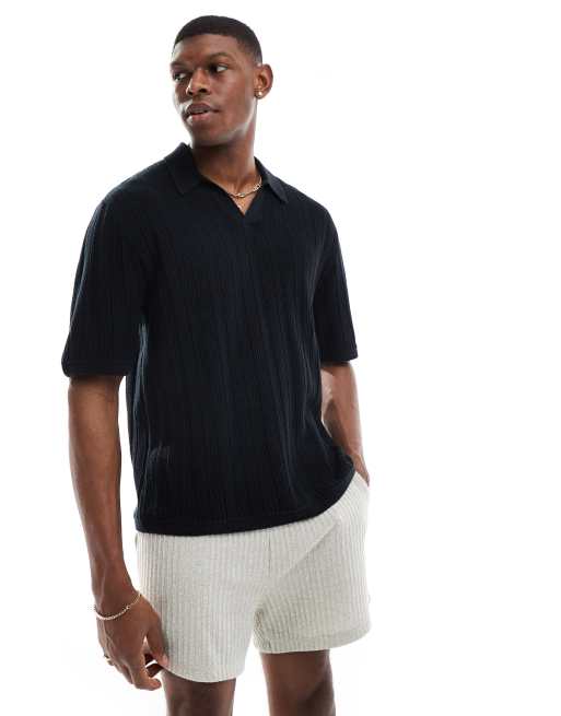 Polo negro a rayas en contraste de manga corta de punto de Hollister
