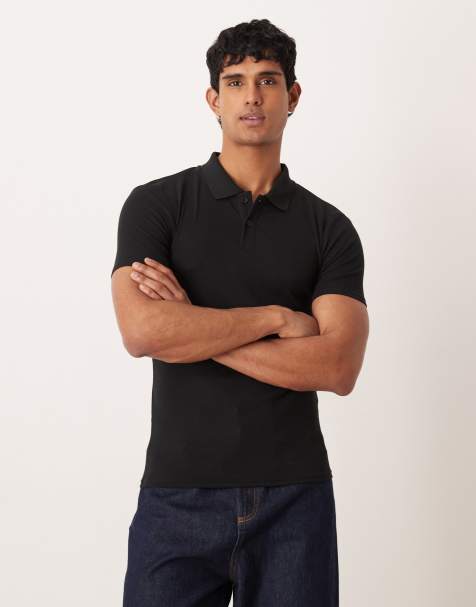 Polo negro ajustado básico de canalé Essentials de ASOS DESIGN - view 1
