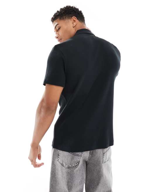 Polo negro con cremallera de punto de arroz de ASOS DESIGN, 2 de 4