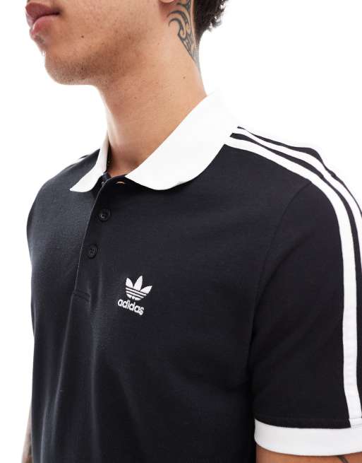 Polo negro con diseño de rayas adicolor classics de adidas