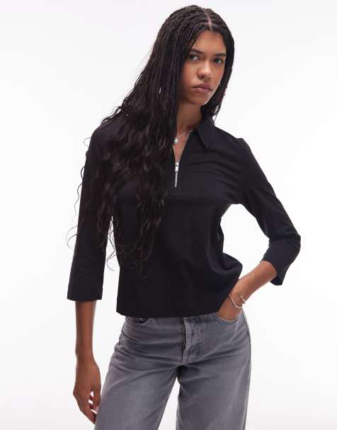 Polo negro con mangas 3/4 y cremallera al cuello de punto acanalado de ARKET - view 1