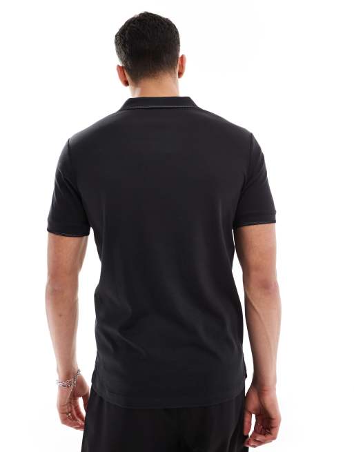 Polo negro con tapeta abierta de Calvin Klein, 2 de 4