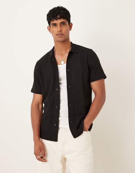 Polo negro texturizado de manga corta de Mango - view 1