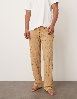 Polo Ralph Lauren Polo Ralph Lauren all over icon logo lounge trousers in camel-Neutral