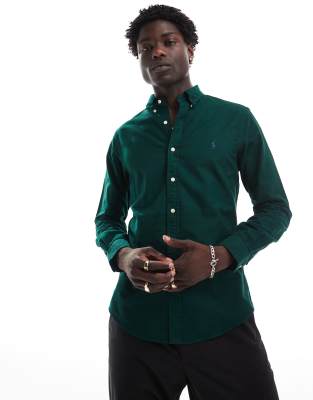 Polo Ralph Lauren icon logo slim fit garment dyed oxford shirt in dark green 139.00 Grazia