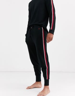 black joggers with red and white stripe