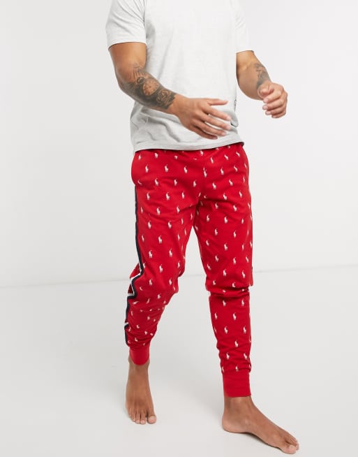 Polo Ralph Lauren loungewear cuffed sweatpants with side stripe and all over polo player logo in red