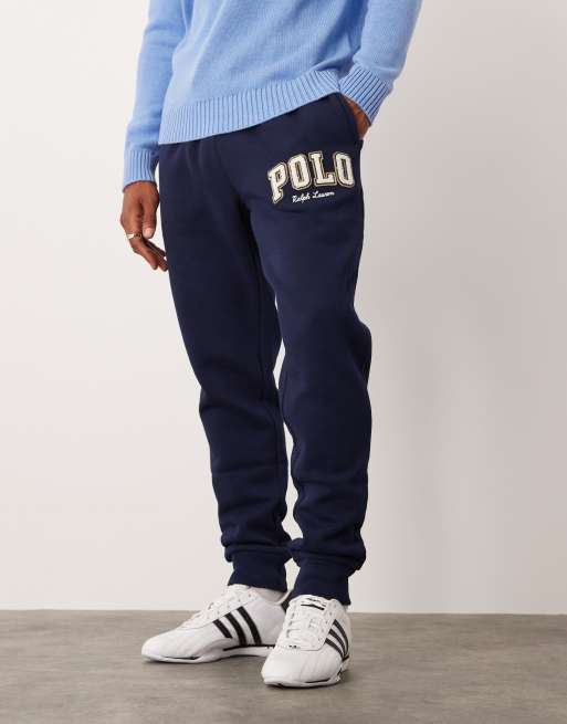 Polo Ralph Lauren - Marineblå joggingbukser med tætsiddende buksekanter og college-logo i fleece