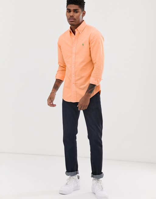 Orange polo button on sale down