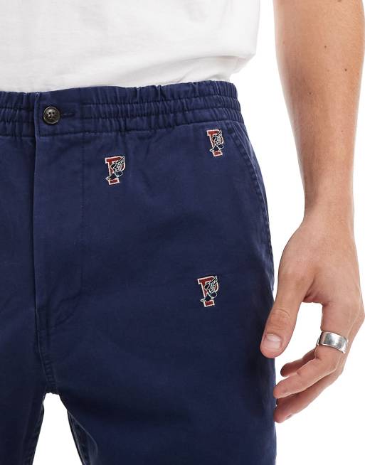 Polo Ralph Lauren Prepsters all over retro sports logo embroidery flat front twill chino shorts in navy ASOS