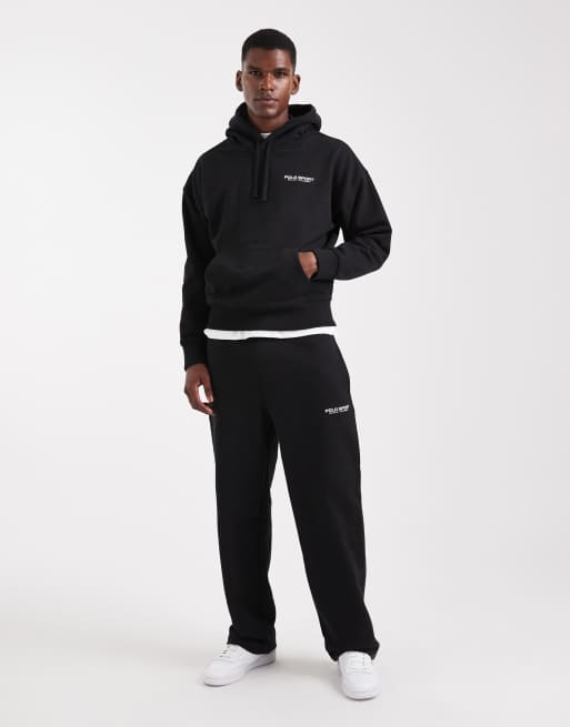 Polo Ralph Lauren - Sport Capsule - Coordinato unisex taglio comodo con con pantaloni e felpa con cappuccio in pile nero con logo con bandiera sul retro