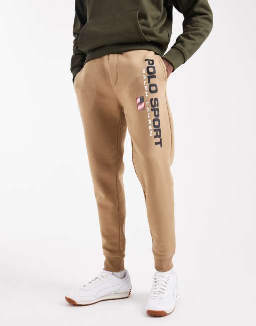 Polo Ralph Lauren – Sport Capsule – Dzianinowe joggersy ze ściągaczem i logo z flagą w beżowym kolorze z nutą khaki