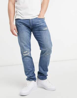 polo and ripped jeans