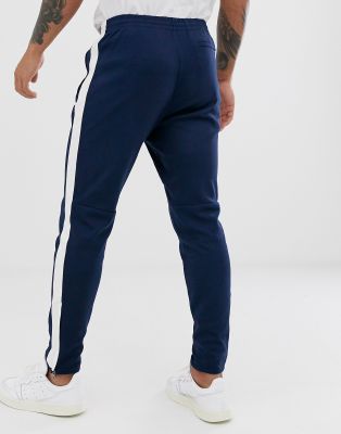 blue joggers with white stripe