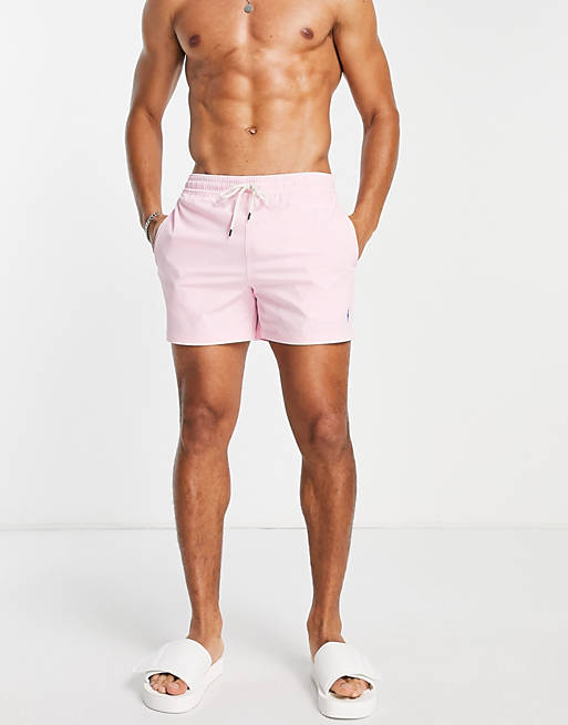 in front of Drama bond Polo Ralph Lauren Traveler icon logo mid swim shorts in pink | ASOS