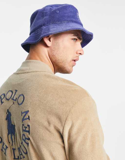 https://images.asos-media.com/products/polo-ralph-lauren-x-asos-exclusive-collab-bucket-hat-with-circle-logo-in-navy/201964191-4?$n_640w$&wid=513&fit=constrain