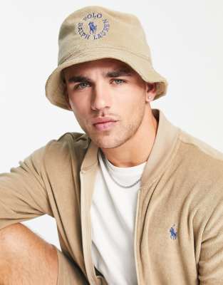 Polo Ralph Lauren x ASOS exclusive collab bucket hat with circle logo in tan - ASOS Price Checker