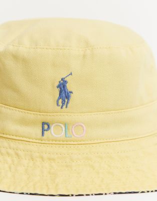 black and yellow polo hat