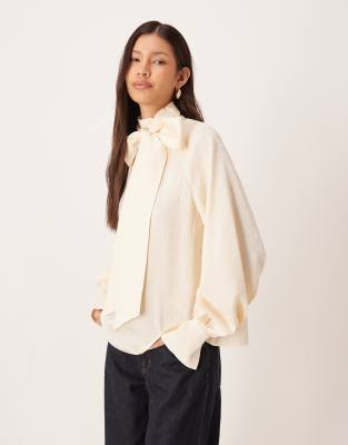Pretty Lavish Oversized Pussybow Bell Sleeve Blouse In Neutral