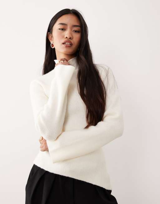 Pretty Lavish ribebd knit roll neck asymmetric hem top in cream