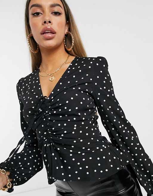 PrettyLittleThing blouse with ruched front detail in black polka dot