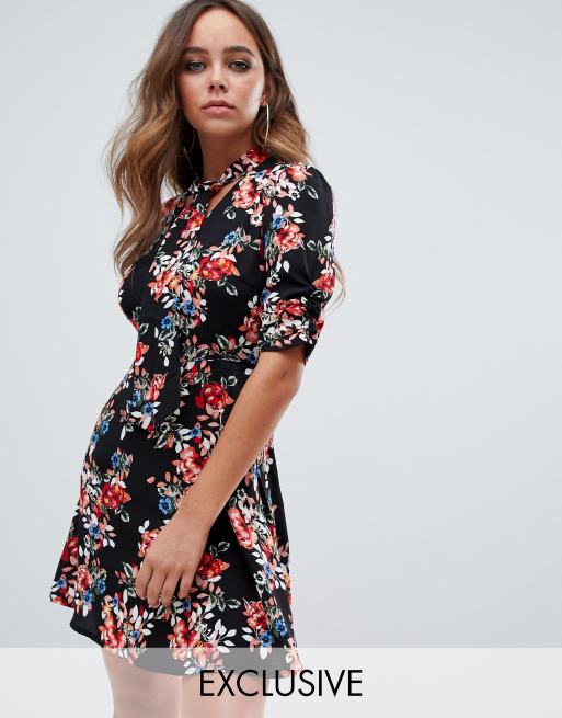 PrettyLittleThing exclusive pussybow skater dress in black floral | ASOS