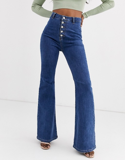 PrettyLittleThing flared jeans with button front in blue